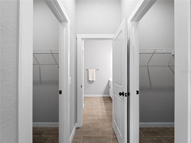 hallway with hardwood / wood-style floors