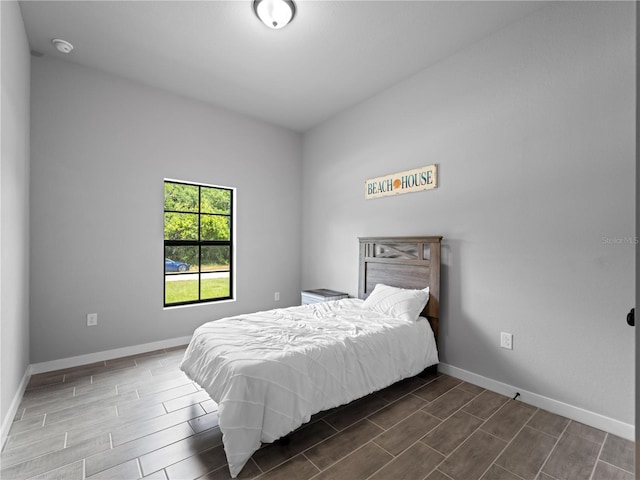 bedroom featuring dark hardwood / wood-style floors