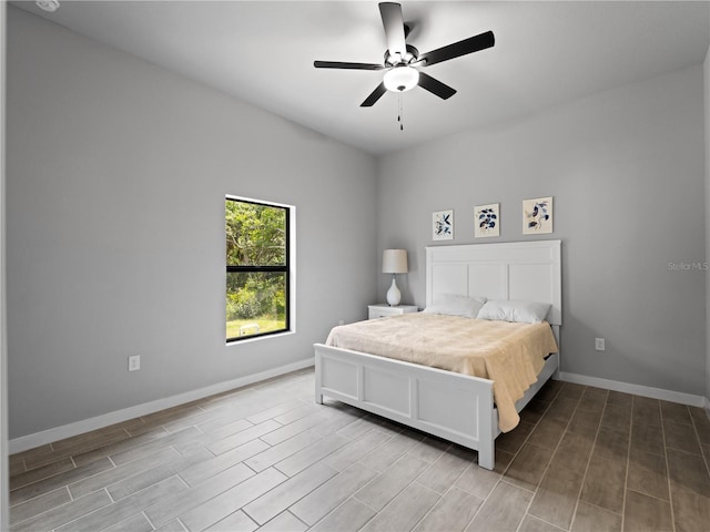 bedroom with hardwood / wood-style floors and ceiling fan