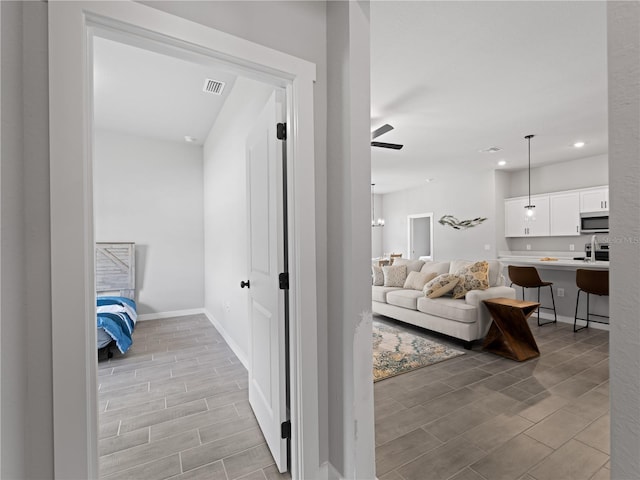 corridor featuring light hardwood / wood-style floors