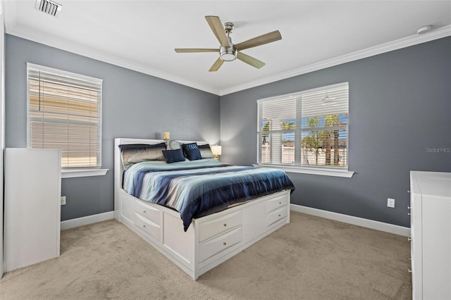 carpeted bedroom featuring ceiling fan and ornamental molding