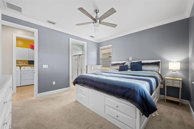 carpeted bedroom featuring ceiling fan, separate washer and dryer, and ornamental molding