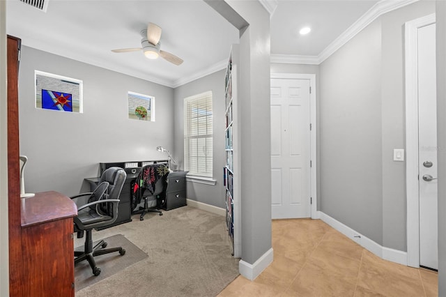 office featuring crown molding, ceiling fan, and light carpet