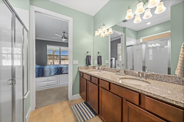 bathroom featuring tile patterned floors, ornamental molding, vanity, ceiling fan, and a shower with shower door