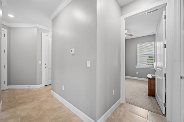 hall with light carpet and crown molding