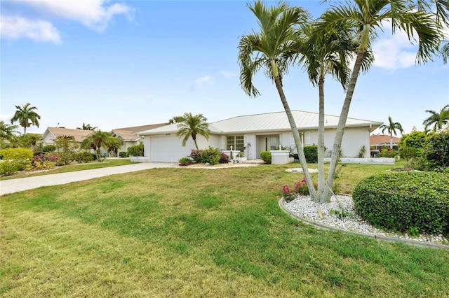 ranch-style home with a front yard and a garage