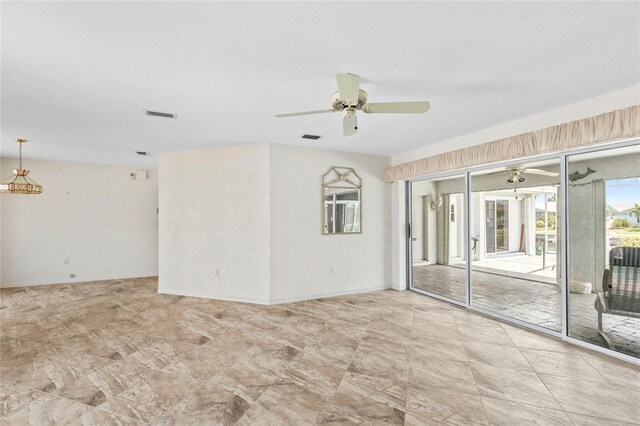 spare room with ceiling fan