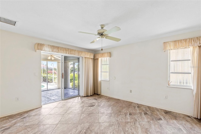 unfurnished room with ceiling fan