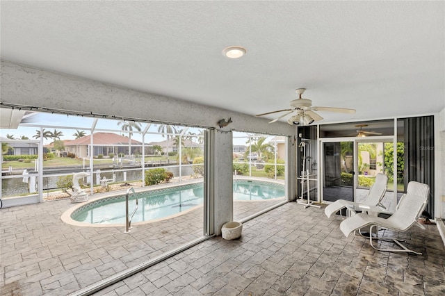 view of swimming pool featuring ceiling fan