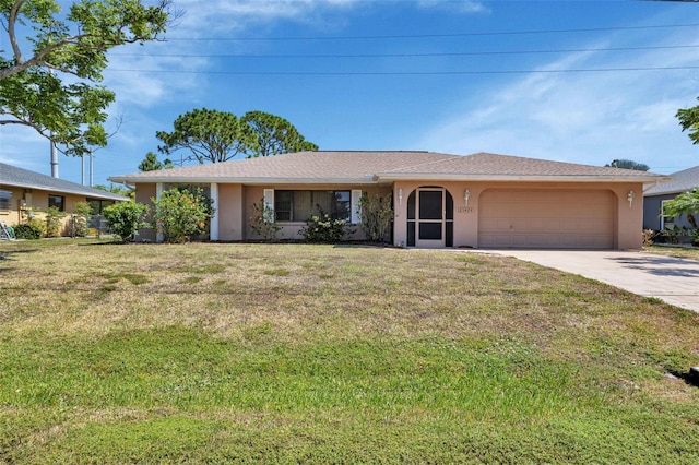 ranch-style house with a garage and a front lawn