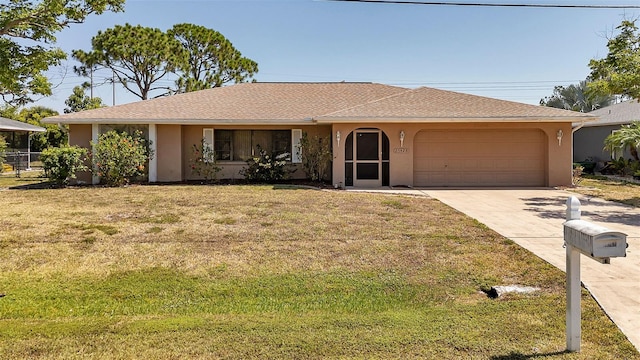 single story home with a front lawn and a garage