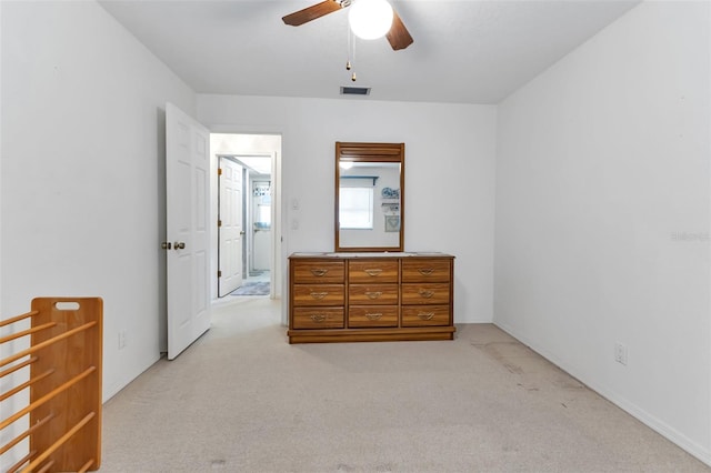 bedroom with light carpet and ceiling fan