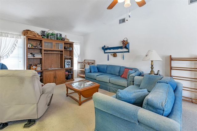 living room with carpet and ceiling fan