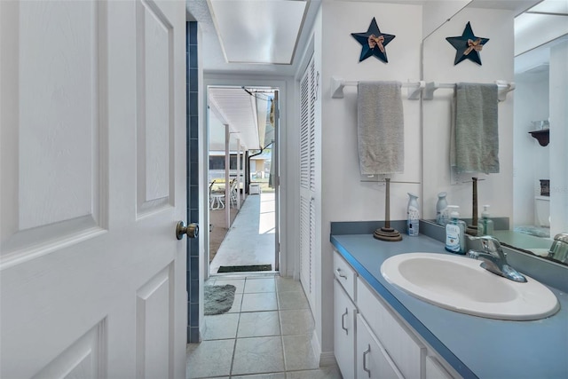 bathroom with tile patterned flooring and vanity