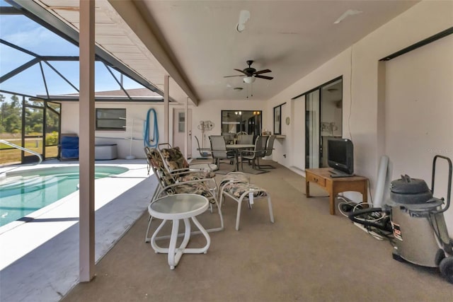 view of patio / terrace with ceiling fan and a lanai