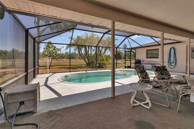 view of pool with a lanai and a patio