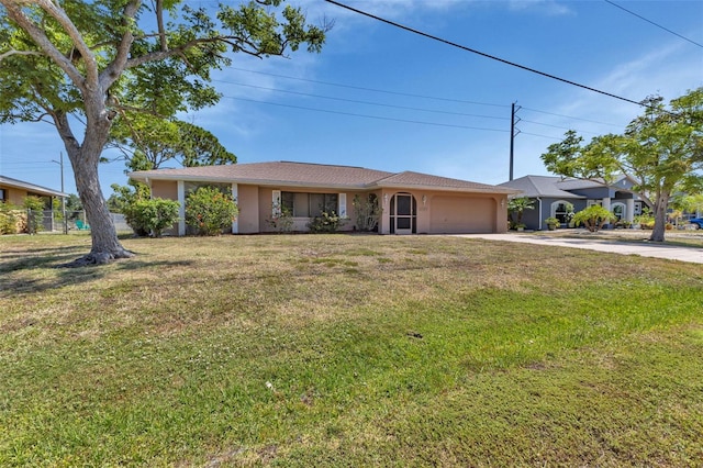 ranch-style house with a garage and a front lawn