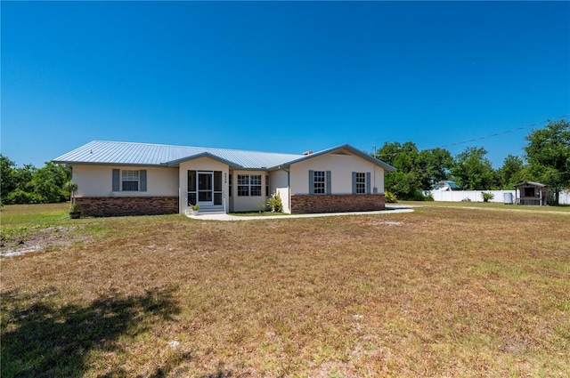 ranch-style house featuring a front lawn