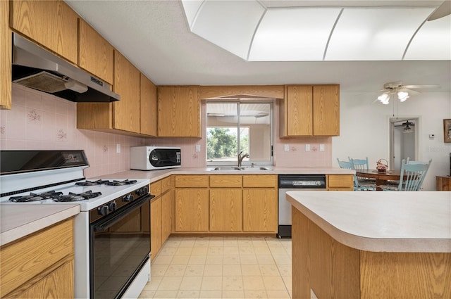 kitchen featuring white appliances, backsplash, sink, ceiling fan, and range hood