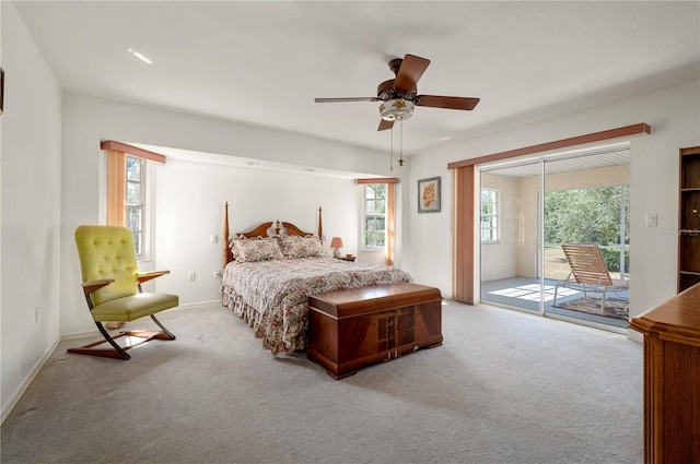 carpeted bedroom featuring access to exterior and ceiling fan