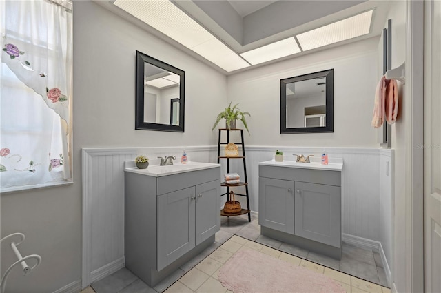 bathroom with tile patterned floors and vanity