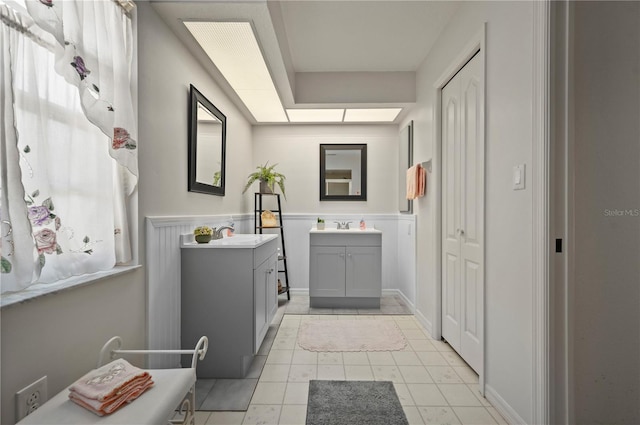 bathroom with tile patterned flooring and vanity