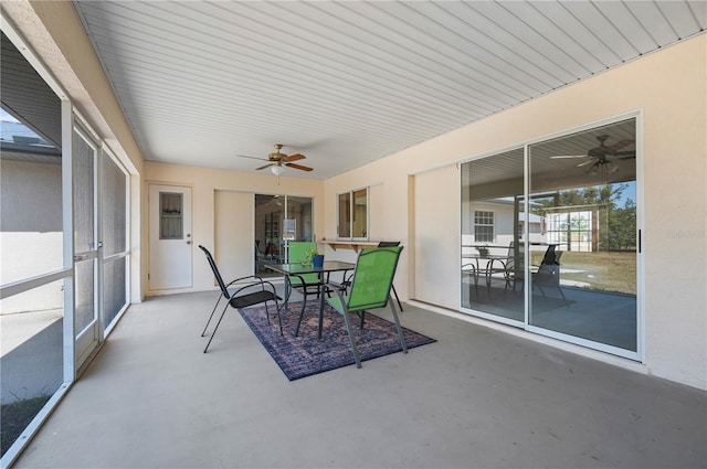 sunroom / solarium with ceiling fan