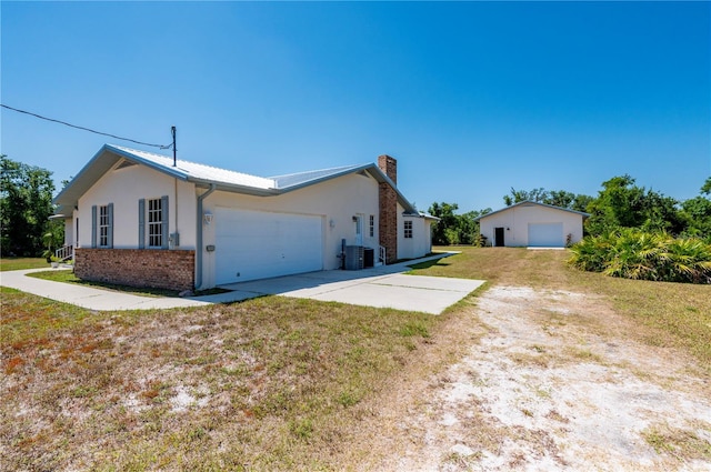 view of front of property with a front yard and cooling unit