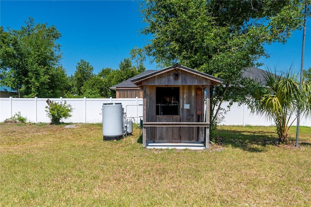 view of outdoor structure featuring a lawn