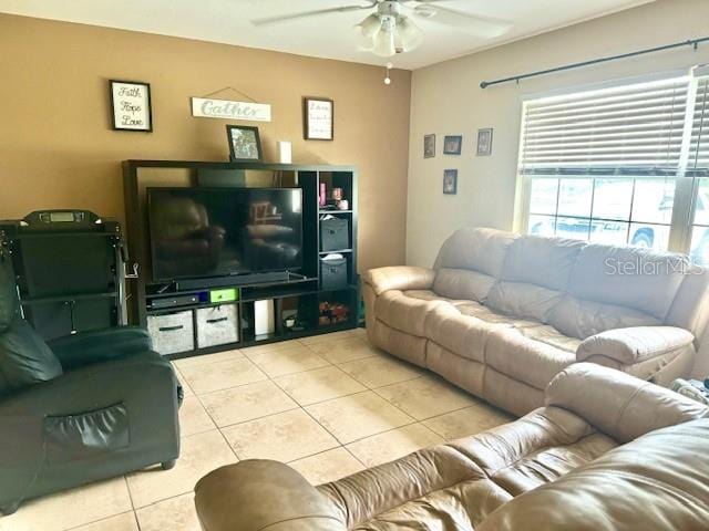 tiled living room featuring ceiling fan