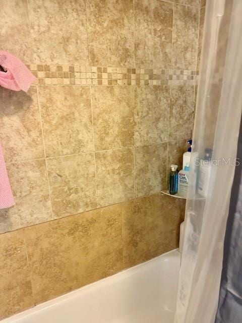 full bathroom with shower / tub combo