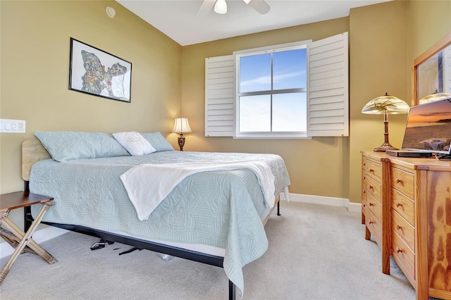 bedroom featuring ceiling fan and light carpet