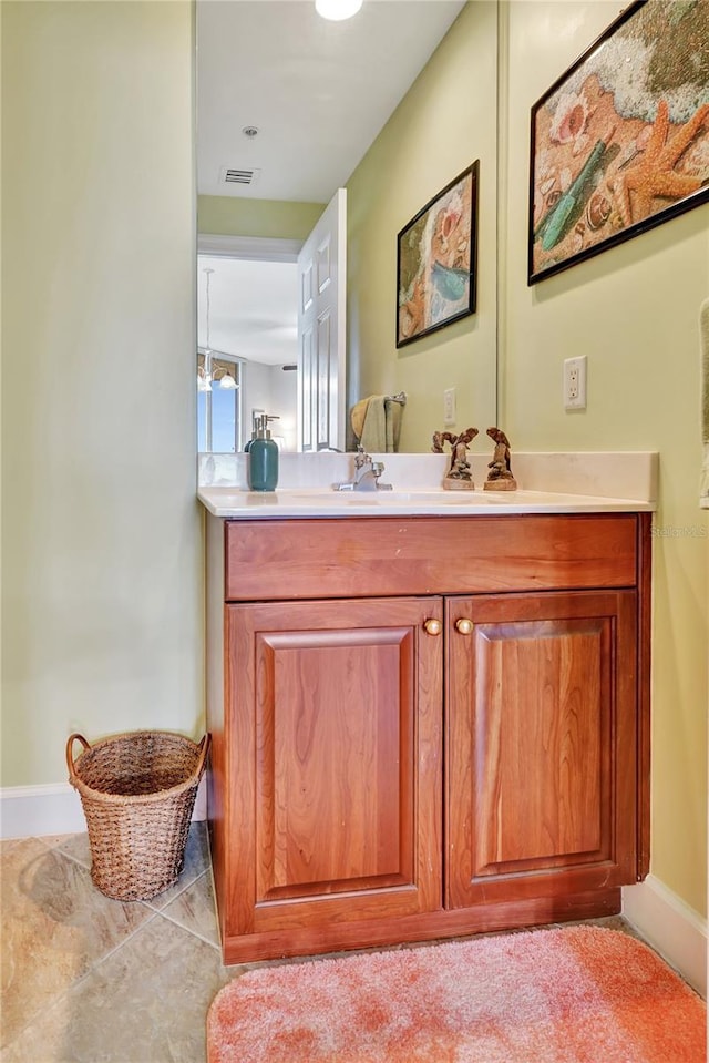 bathroom featuring tile patterned flooring and vanity