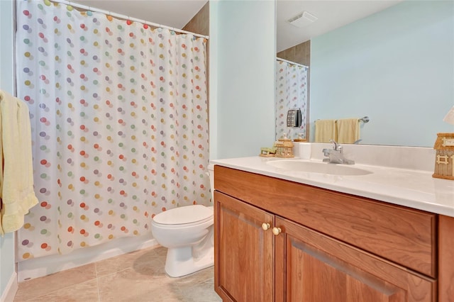 bathroom featuring a shower with curtain, vanity, toilet, and tile patterned flooring