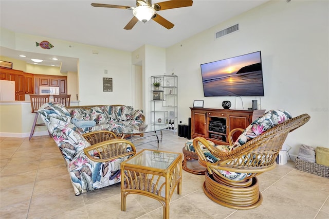 tiled living room featuring ceiling fan