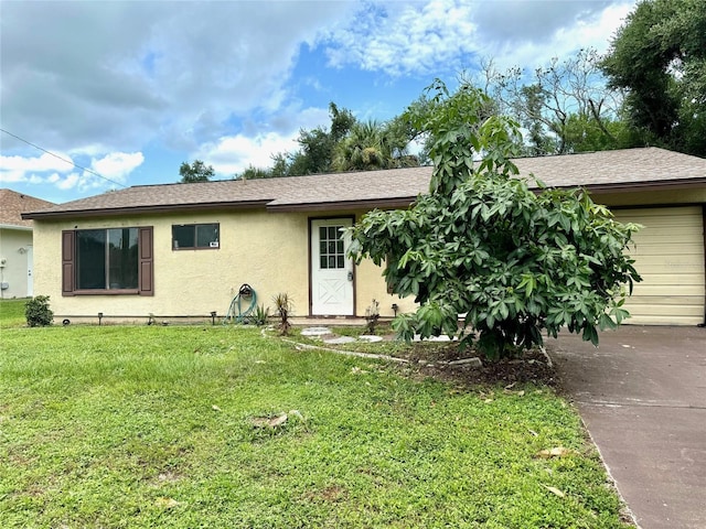 single story home featuring a garage, stucco siding, roof with shingles, and a front yard