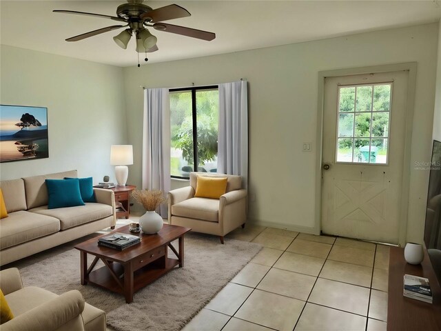 living room featuring ceiling fan and light tile patterned flooring