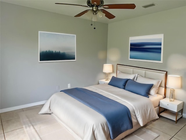 tiled bedroom with a ceiling fan, visible vents, and baseboards