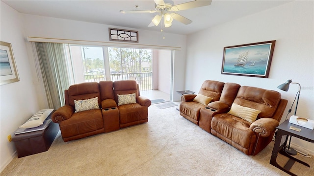 carpeted living room featuring ceiling fan