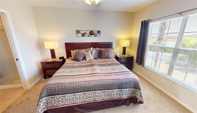 bedroom featuring carpet flooring, multiple windows, and ceiling fan