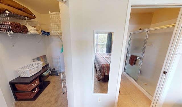 bathroom featuring tile patterned floors and walk in shower