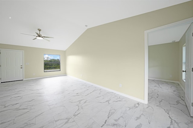 empty room featuring ceiling fan and lofted ceiling