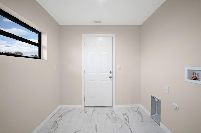 clothes washing area with hookup for a washing machine, laundry area, marble finish floor, and baseboards