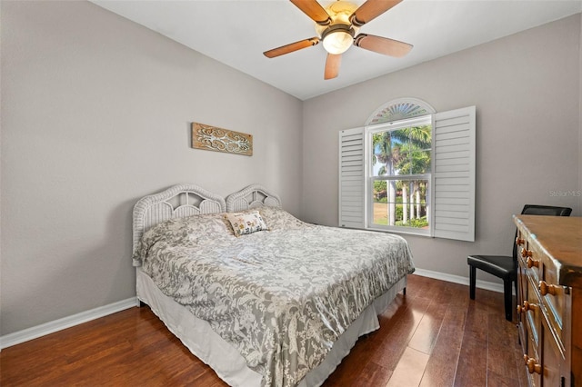 bedroom featuring dark hardwood / wood-style floors and ceiling fan