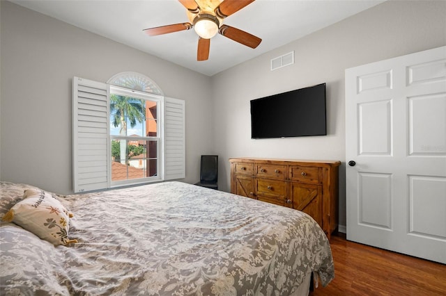 bedroom with ceiling fan and wood-type flooring