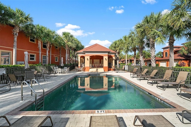 view of swimming pool with a patio