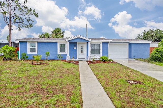 ranch-style house with a garage and a front yard