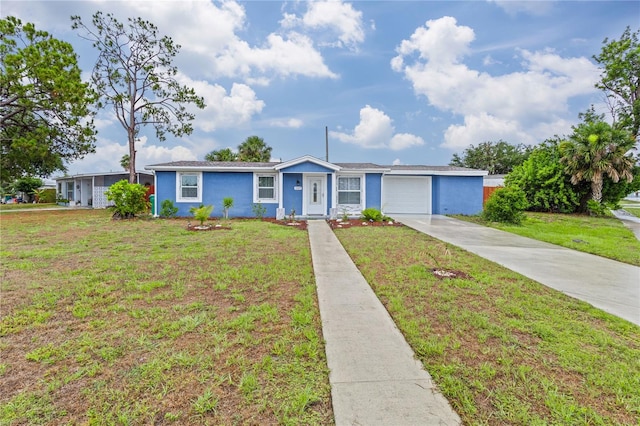 ranch-style home with a front yard and a garage