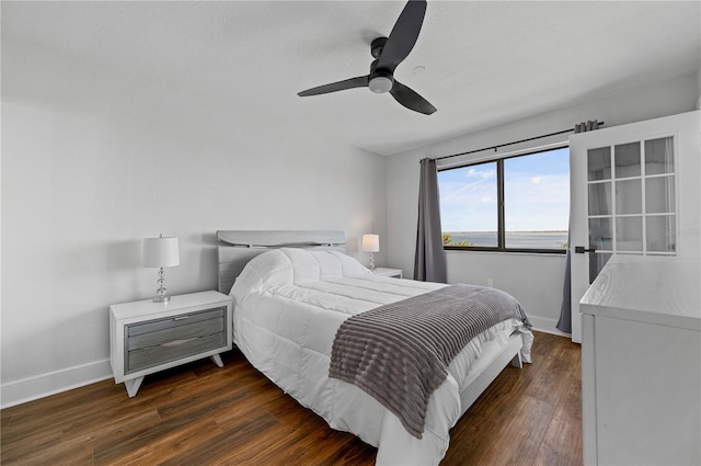 bedroom featuring ceiling fan and dark hardwood / wood-style floors