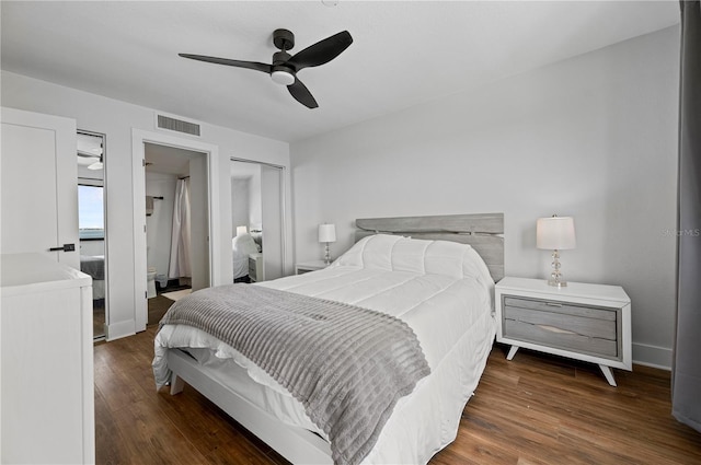 bedroom with ceiling fan and dark hardwood / wood-style floors